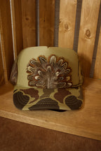 Pheasant feather trucker hat